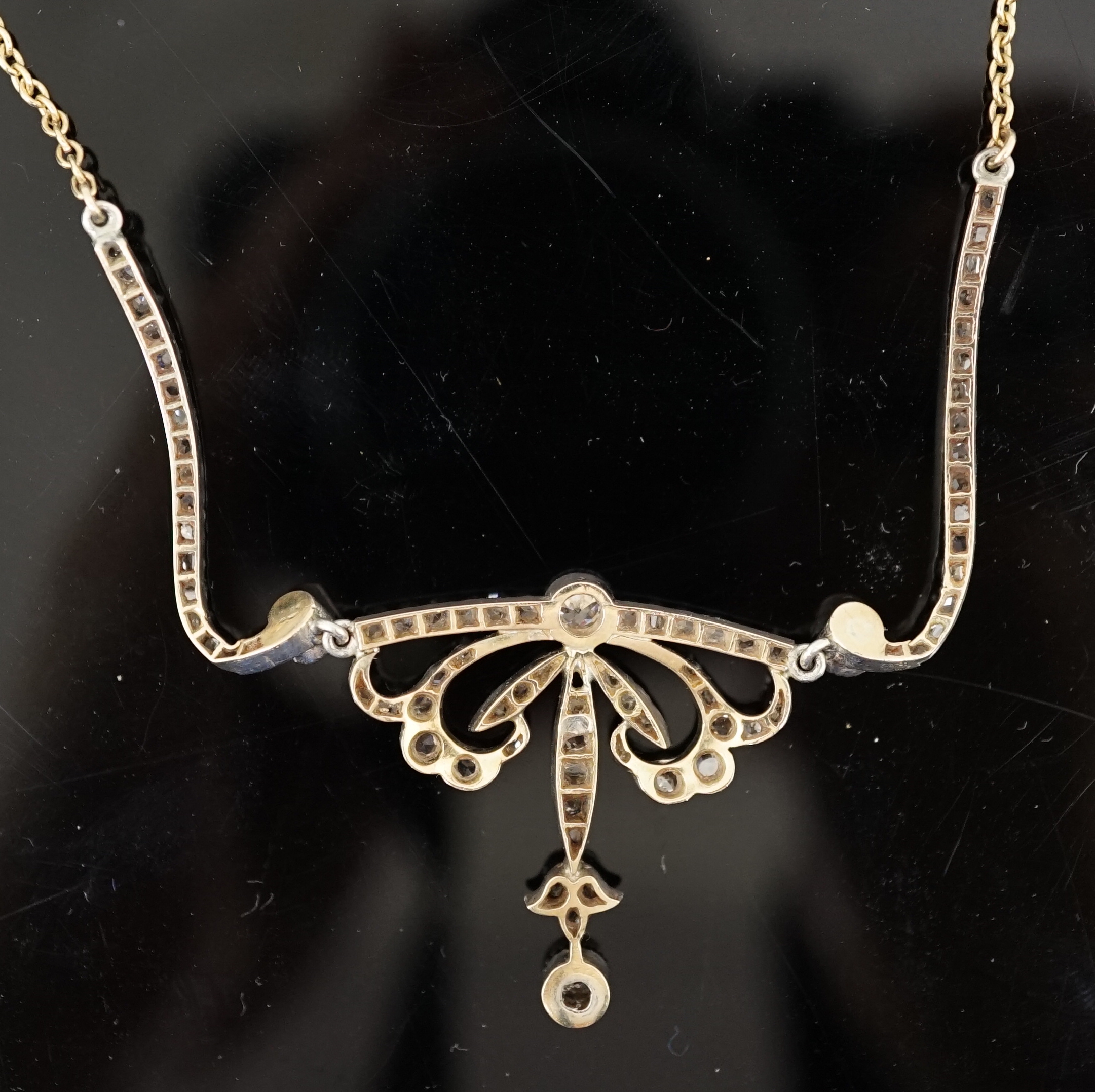 A Belle Epoque gold and silver, round and rose cut diamond cluster set pendant necklace